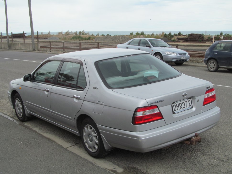 Silver sedan rear and side view with classic taillights