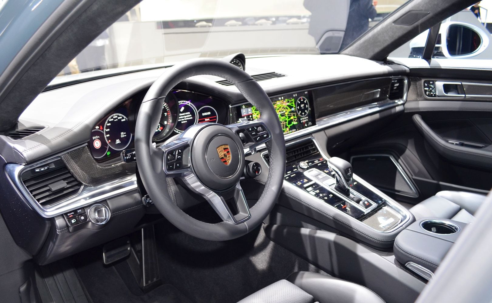 Luxury steering wheel and digital dashboard with central console controls