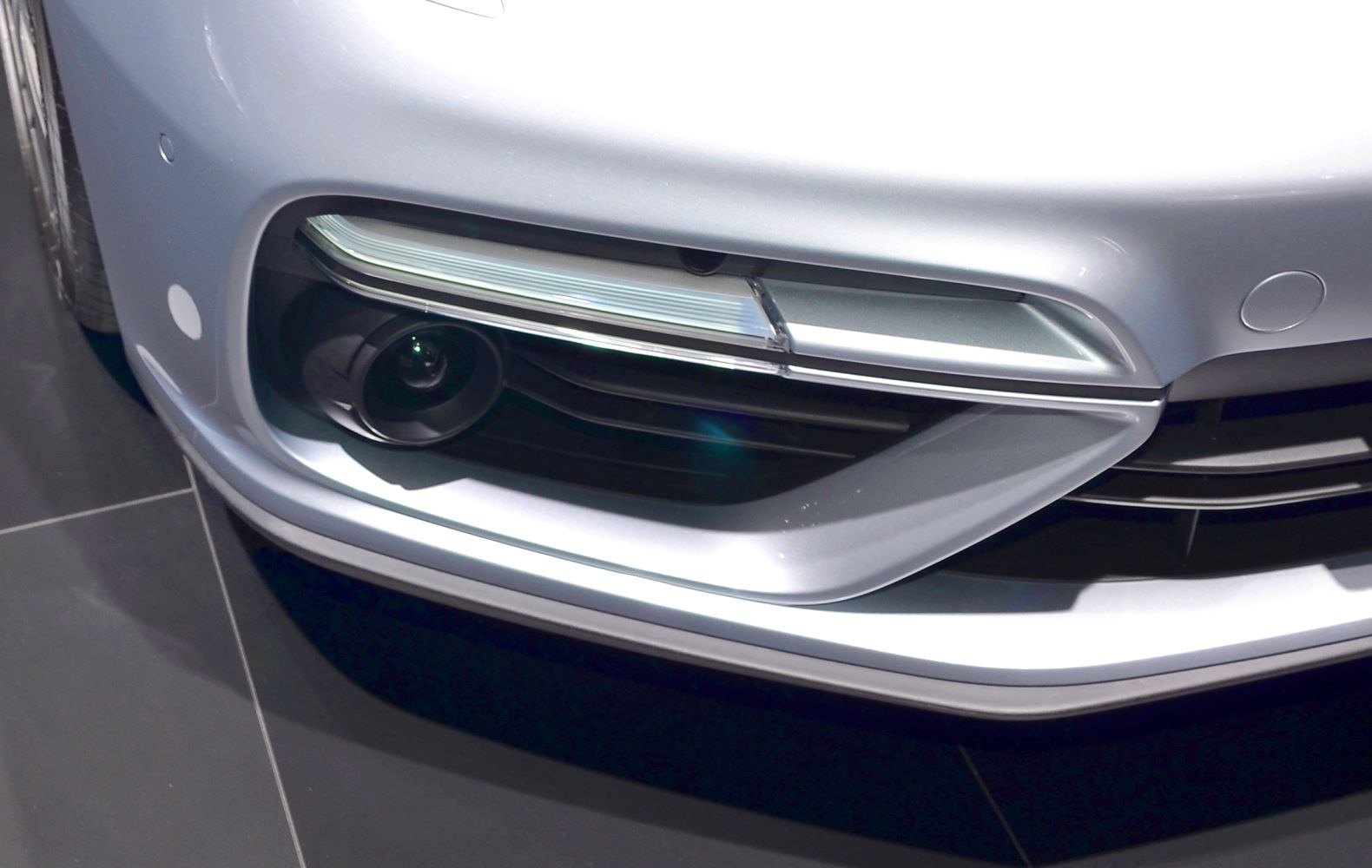 Close-up of front lower bumper with fog light and air intake