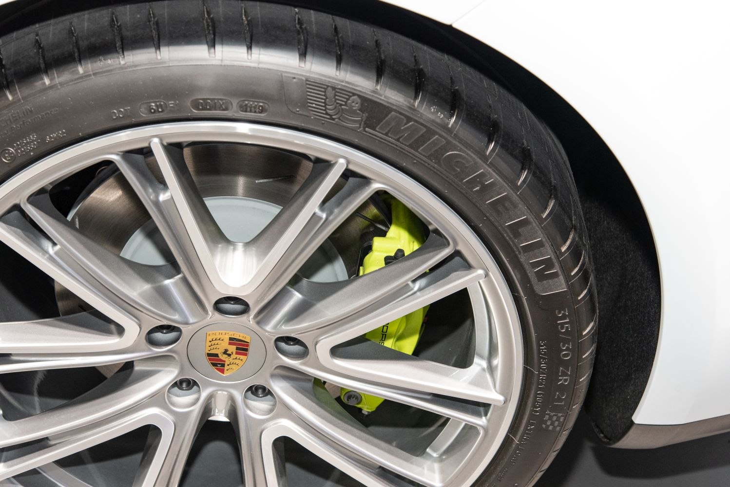 Alloy wheel with yellow brake caliper and Michelin tire detail