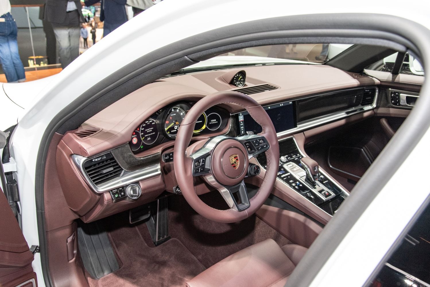 Luxury car interior with dashboard, steering wheel, center console