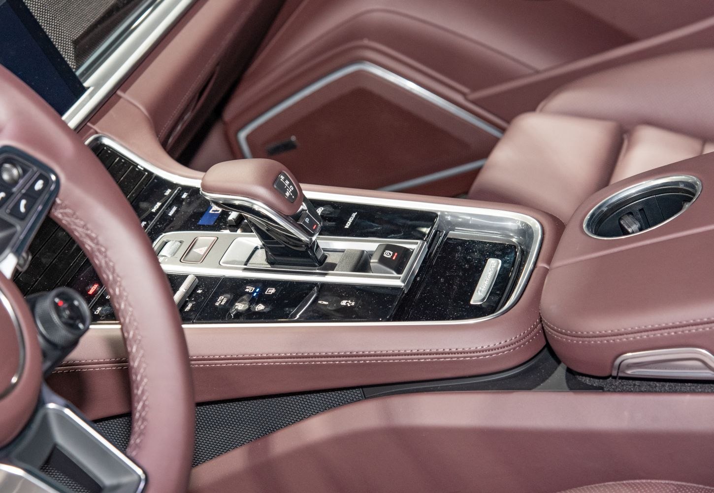 Luxury center console with gear selector and cup holder in premium interior