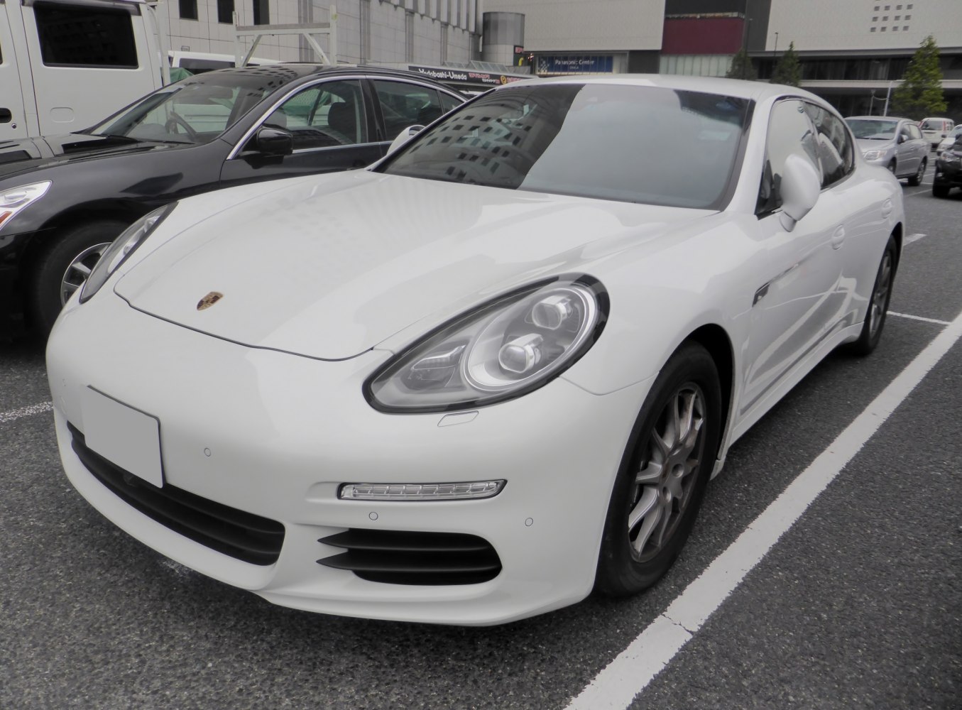 Front view with distinctive oval LED headlights and aerodynamic hood.