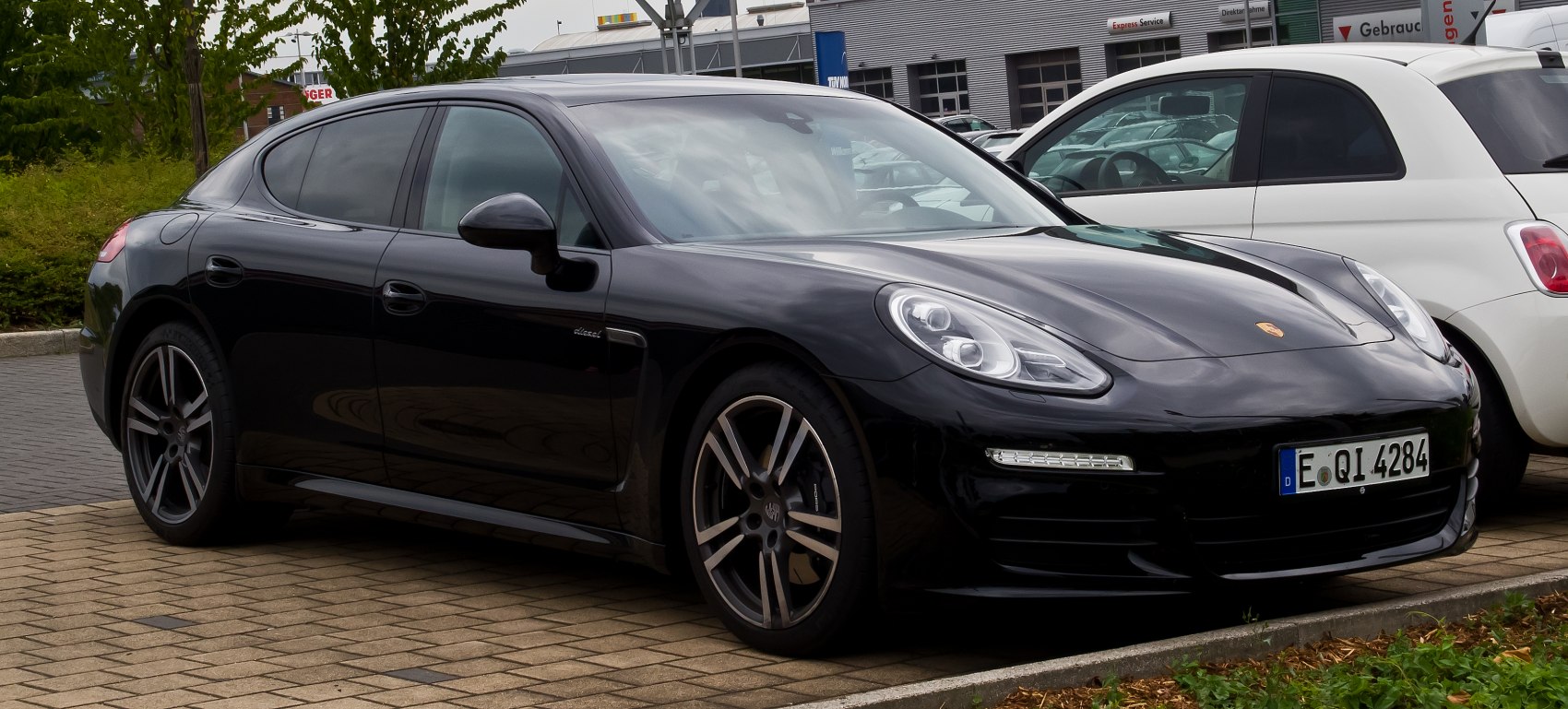 Sleek front side with alloy wheels and distinctive headlights