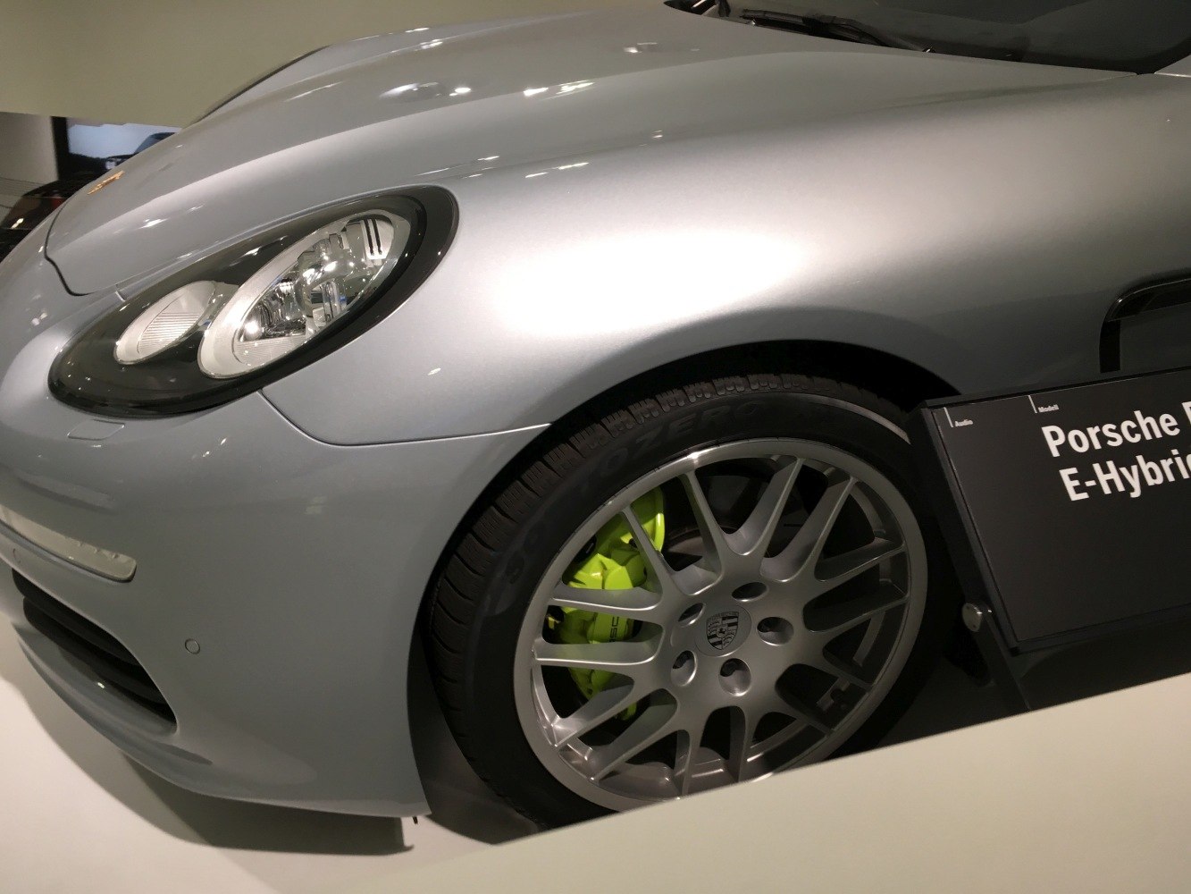 Front wheel with alloy rim and headlight close-up