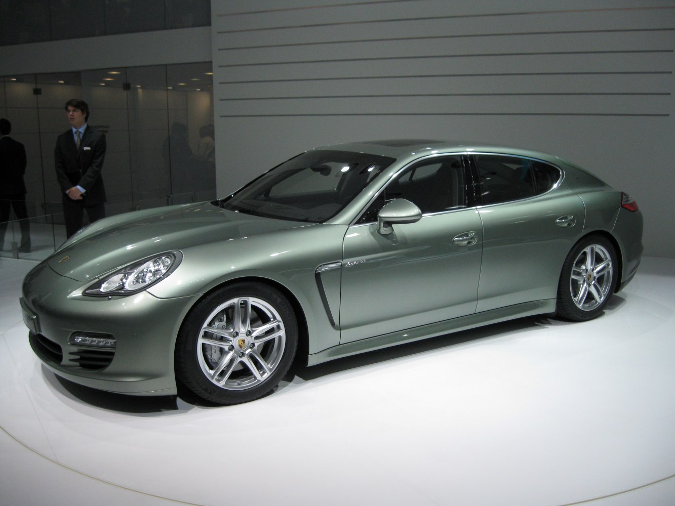 Silver luxury sport sedan with sleek side profile and alloy wheels
