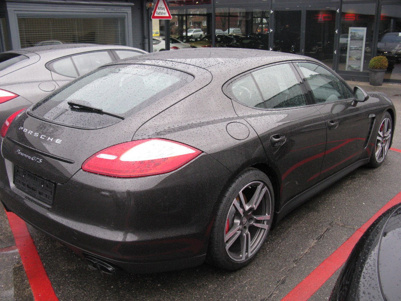 Rear side view with distinctive taillights and alloy wheels