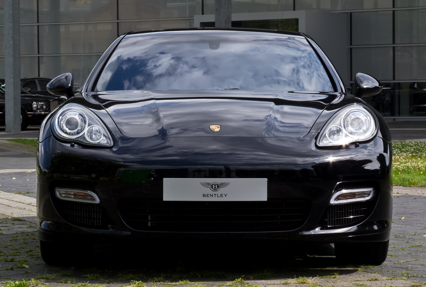 Close-up front view with round headlights and sleek hood design