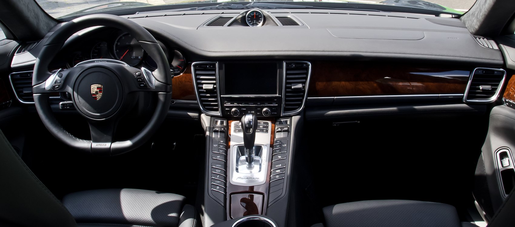 Dashboard and steering wheel interior view with center console