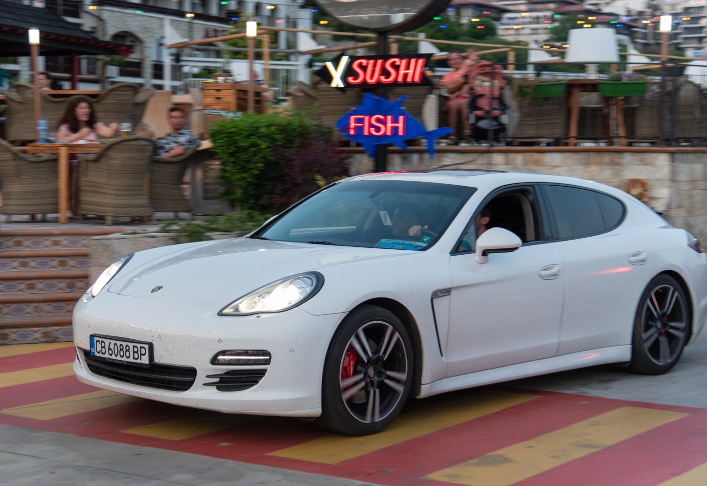 White sports sedan with LED headlights and sporty alloy wheels