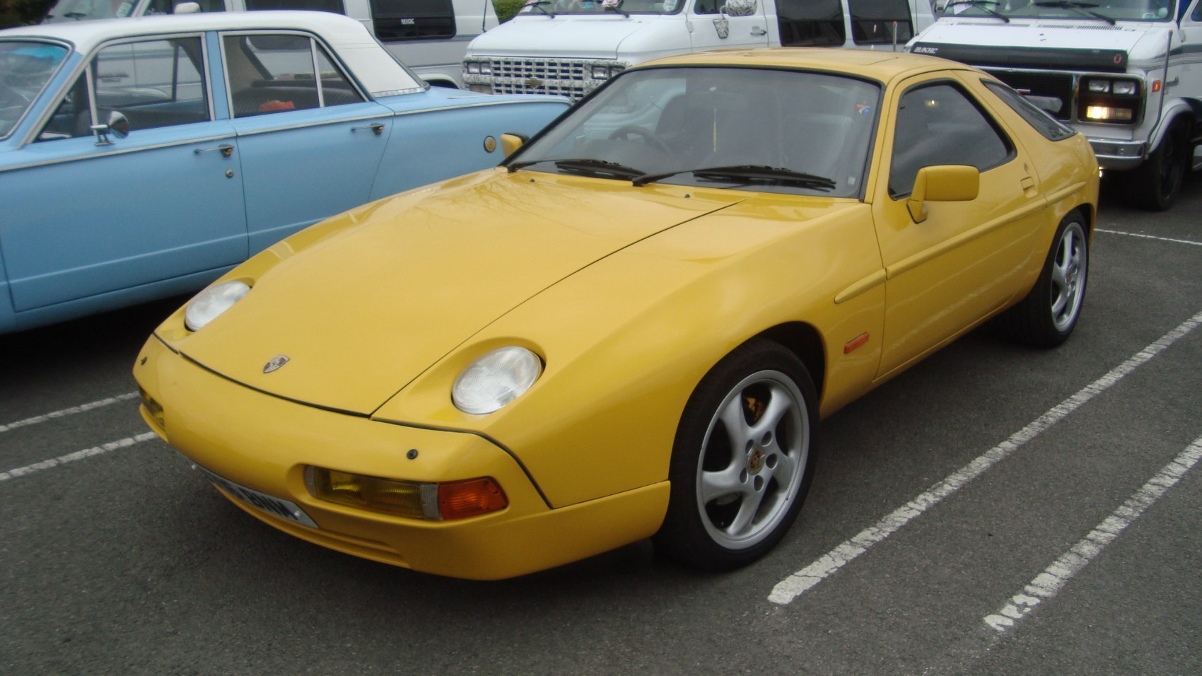Yellow sports car with pop-up headlights and alloy wheels