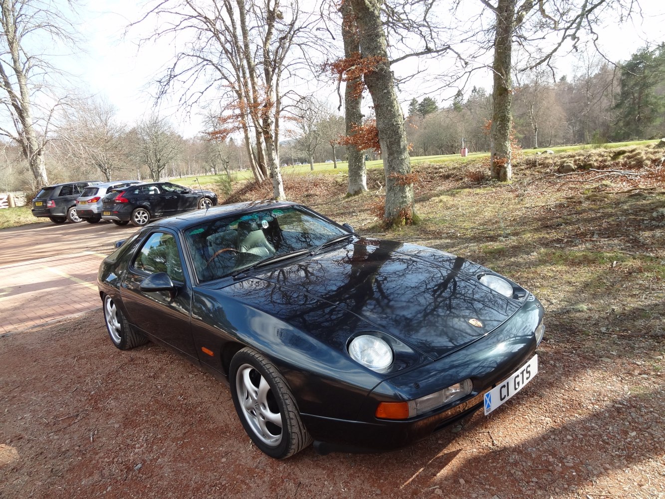 Black sports coupe with pop-up headlights and sleek aerodynamic body