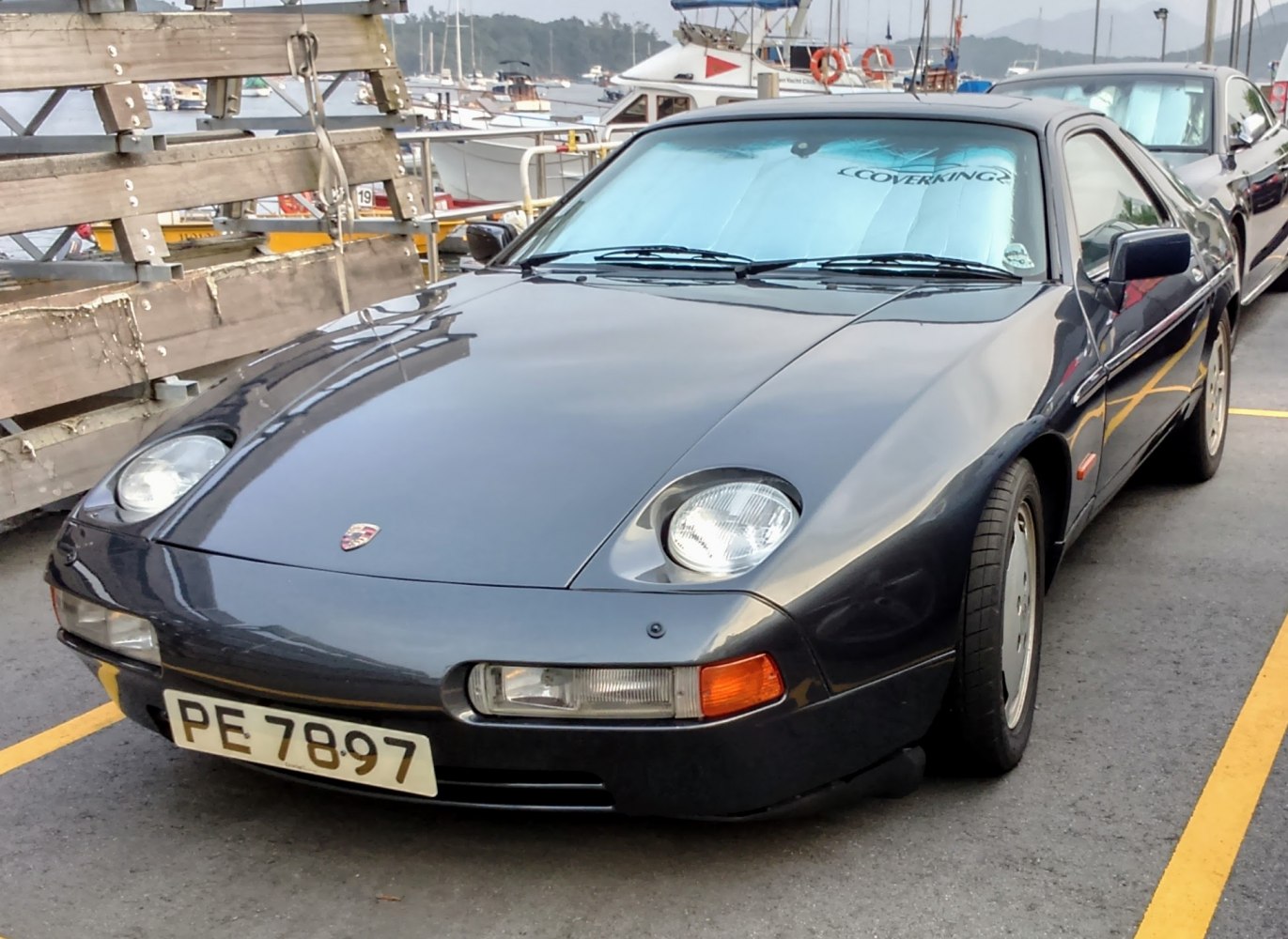 Front view of a classic car with pop-up headlights and smooth lines