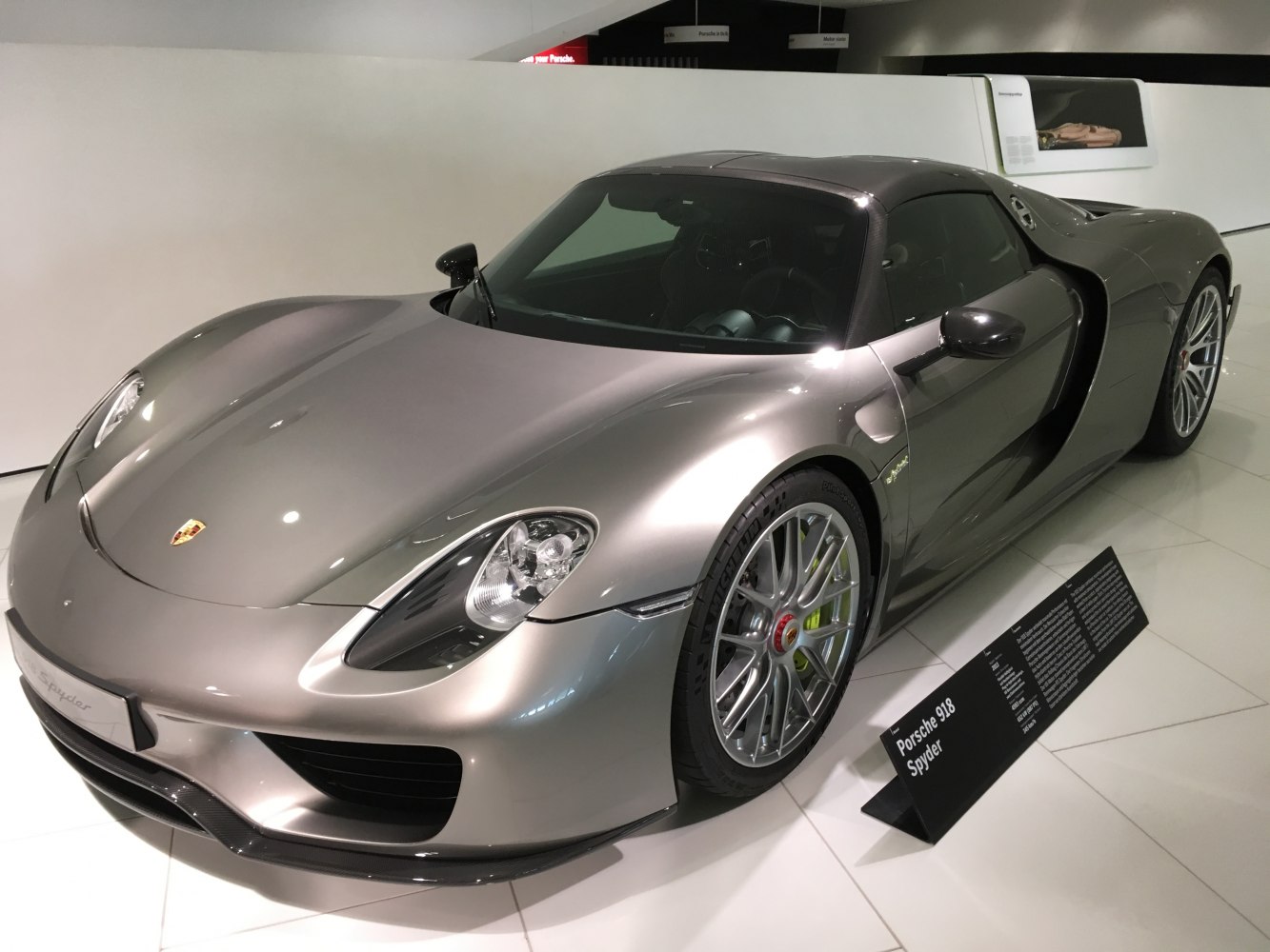 Sleek front hood and aerodynamic side profile with sports wheels and headlights