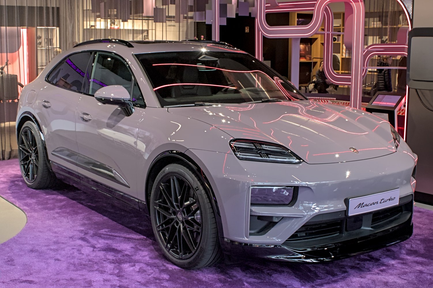 Front 3-4 view of electric SUV with LED headlights and black wheels