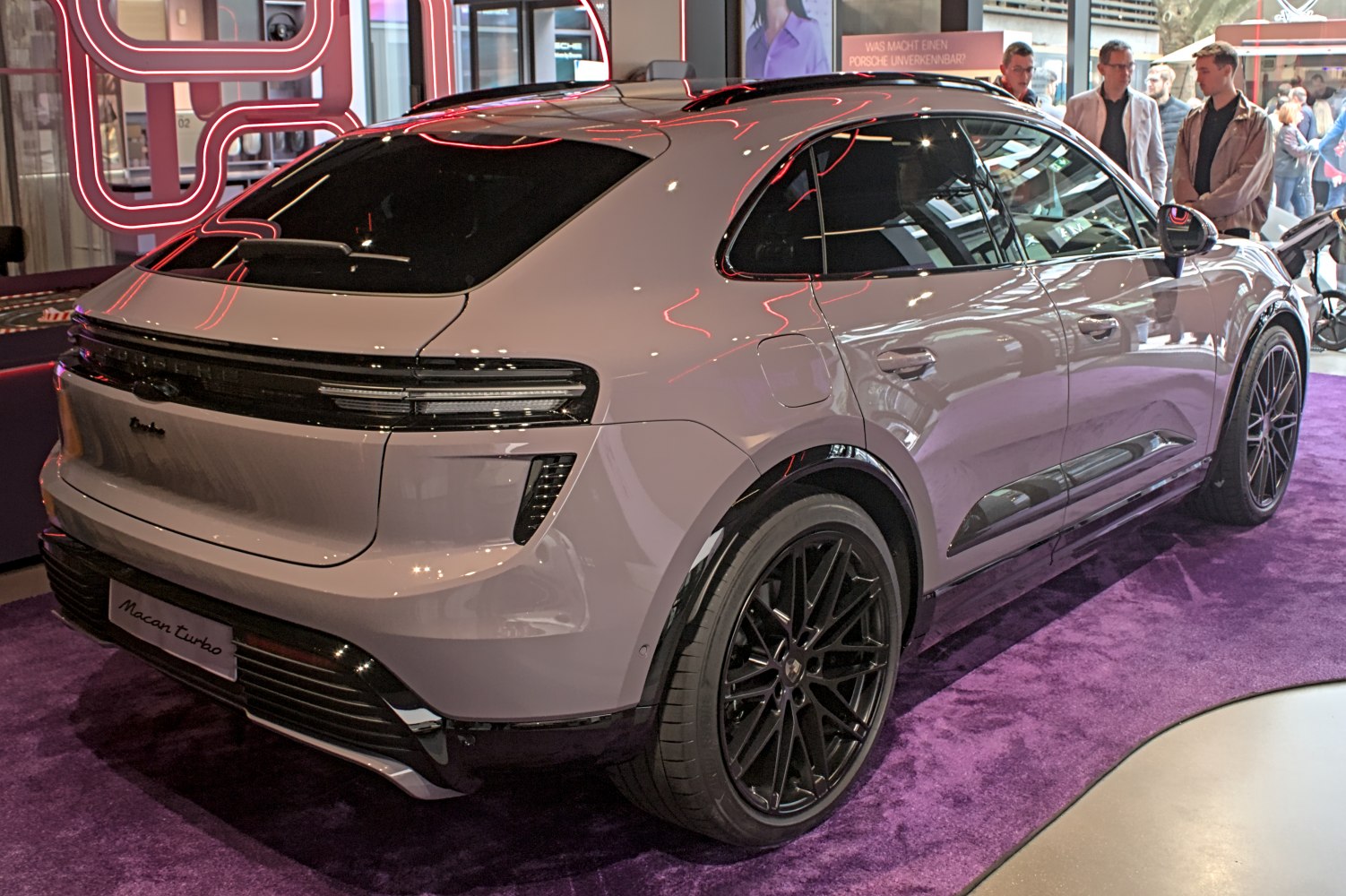 Sleek SUV rear with connected tail lights and black alloy wheels