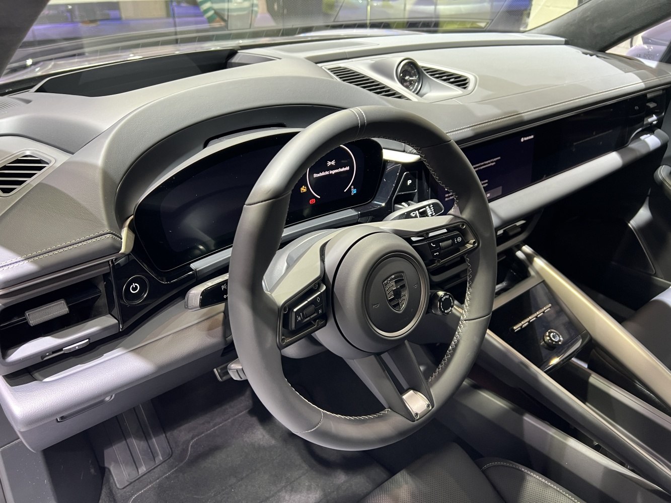 Digital cockpit and modern steering wheel design in electric SUV interior