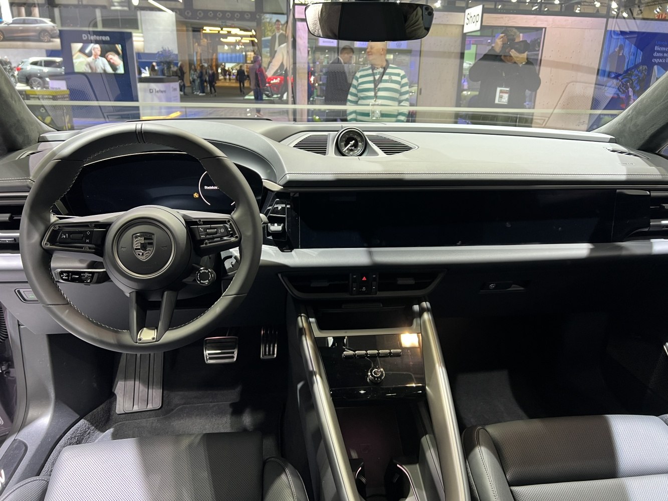 Digital dashboard and sporty steering wheel in a modern car interior