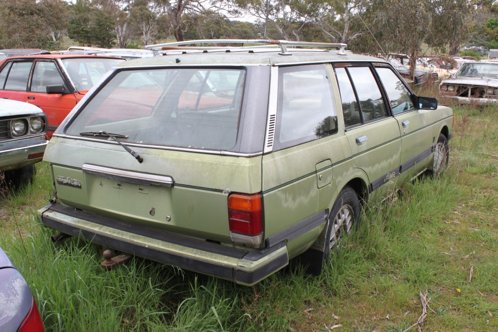 Vintage station wagon rear view with boxy shape and rear windshield wiper