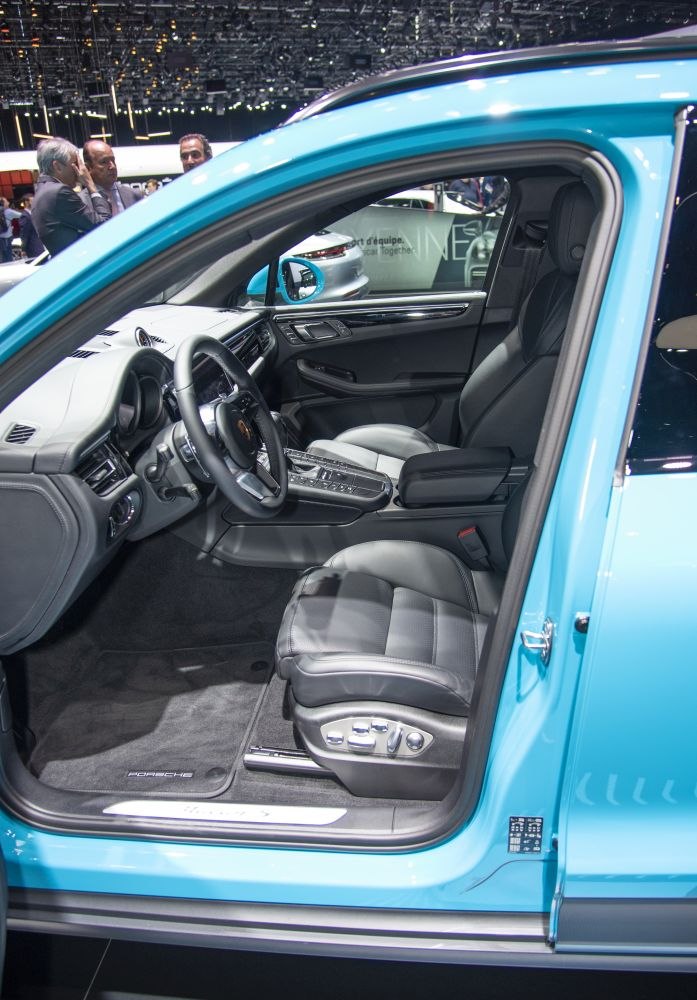 Luxury car interior with advanced seat controls and sleek dashboard design