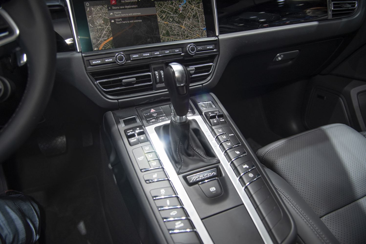 Center console with gear selector and infotainment navigation display