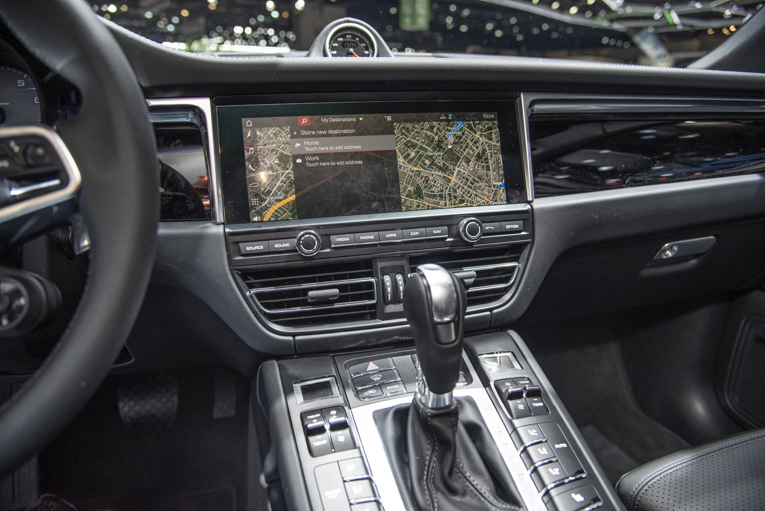 Navigation screen and central console with gear shift and buttons