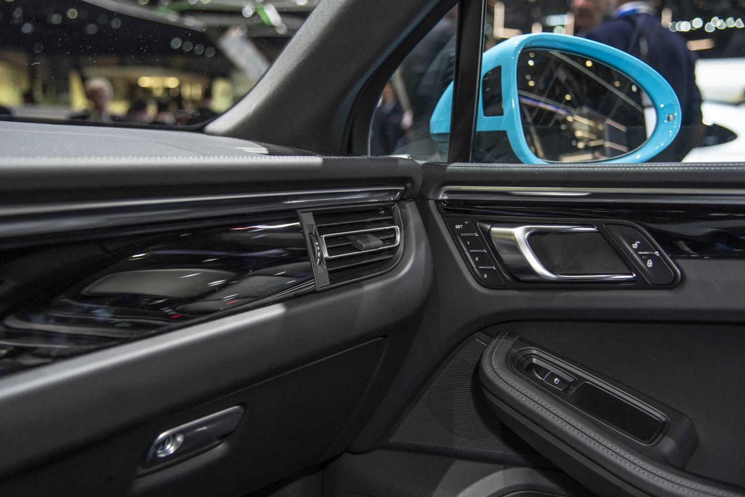 Interior door panel and blue side mirror with controls