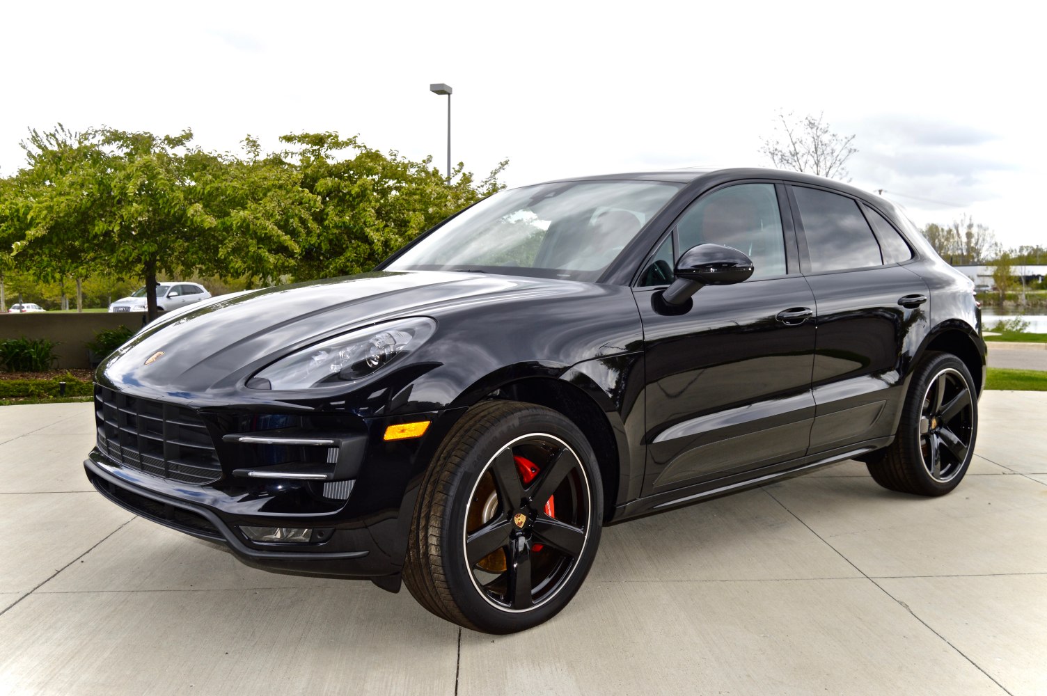 Front side view of black SUV with alloy wheels and sleek body