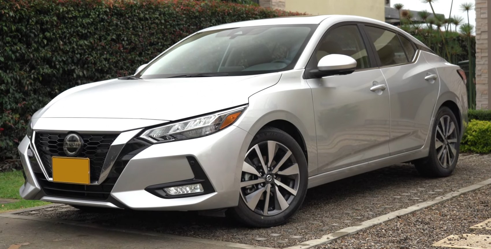 Silver modern sedan with sleek headlights and sporty alloy wheels