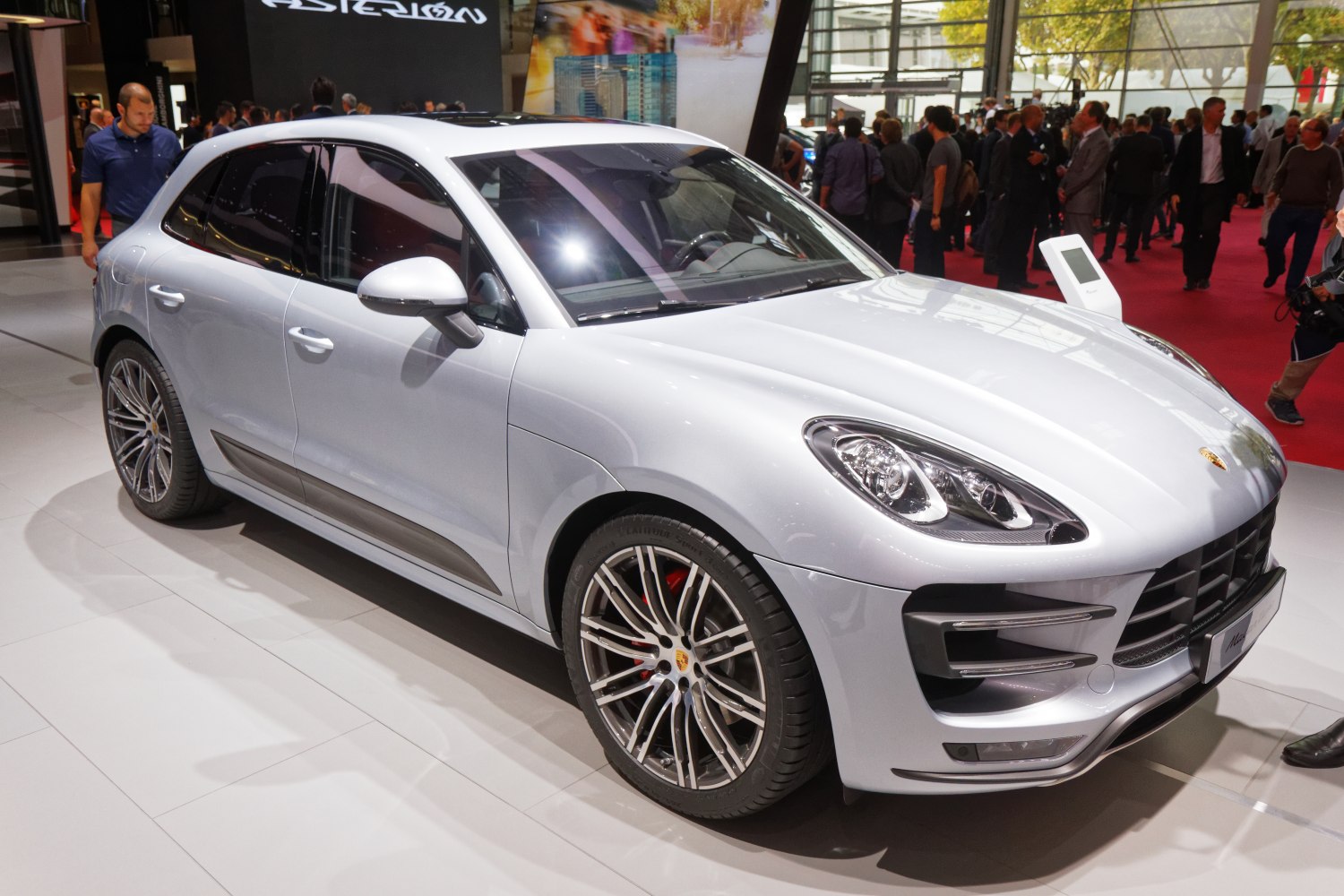 Silver luxury SUV with multi-spoke alloy wheels and sleek headlights