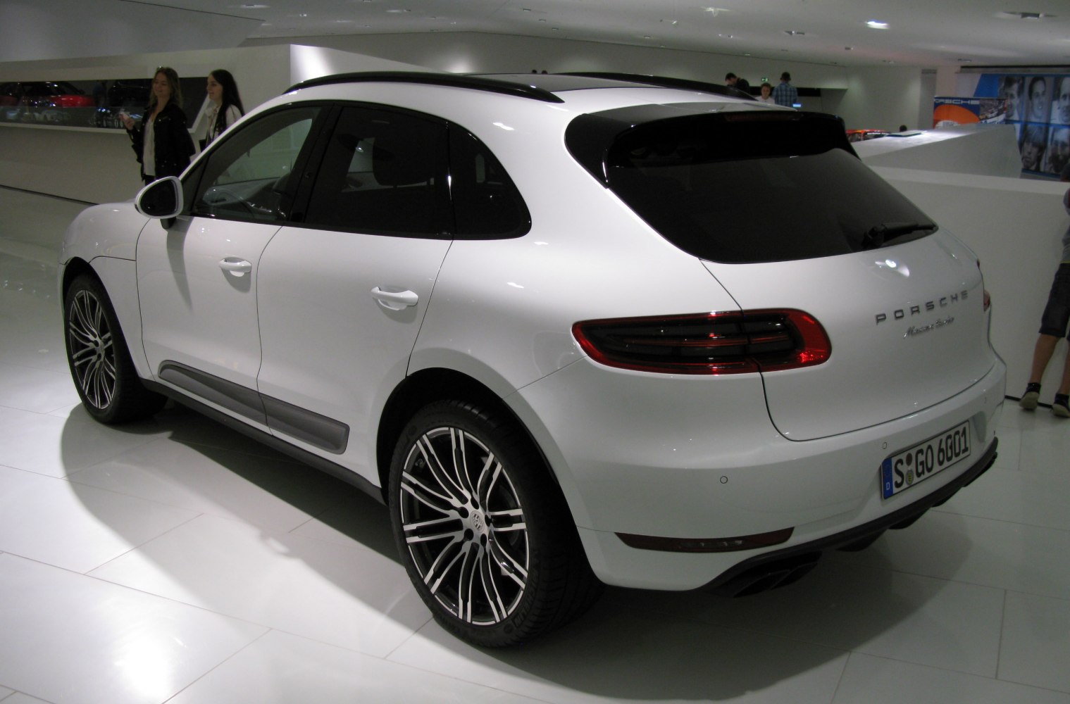 White luxury SUV rear side with modern tail lights and sporty alloy wheels