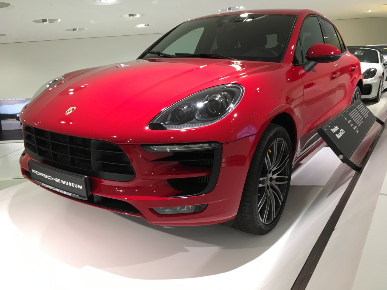 Red SUV front with LED headlights and stylish alloy wheels