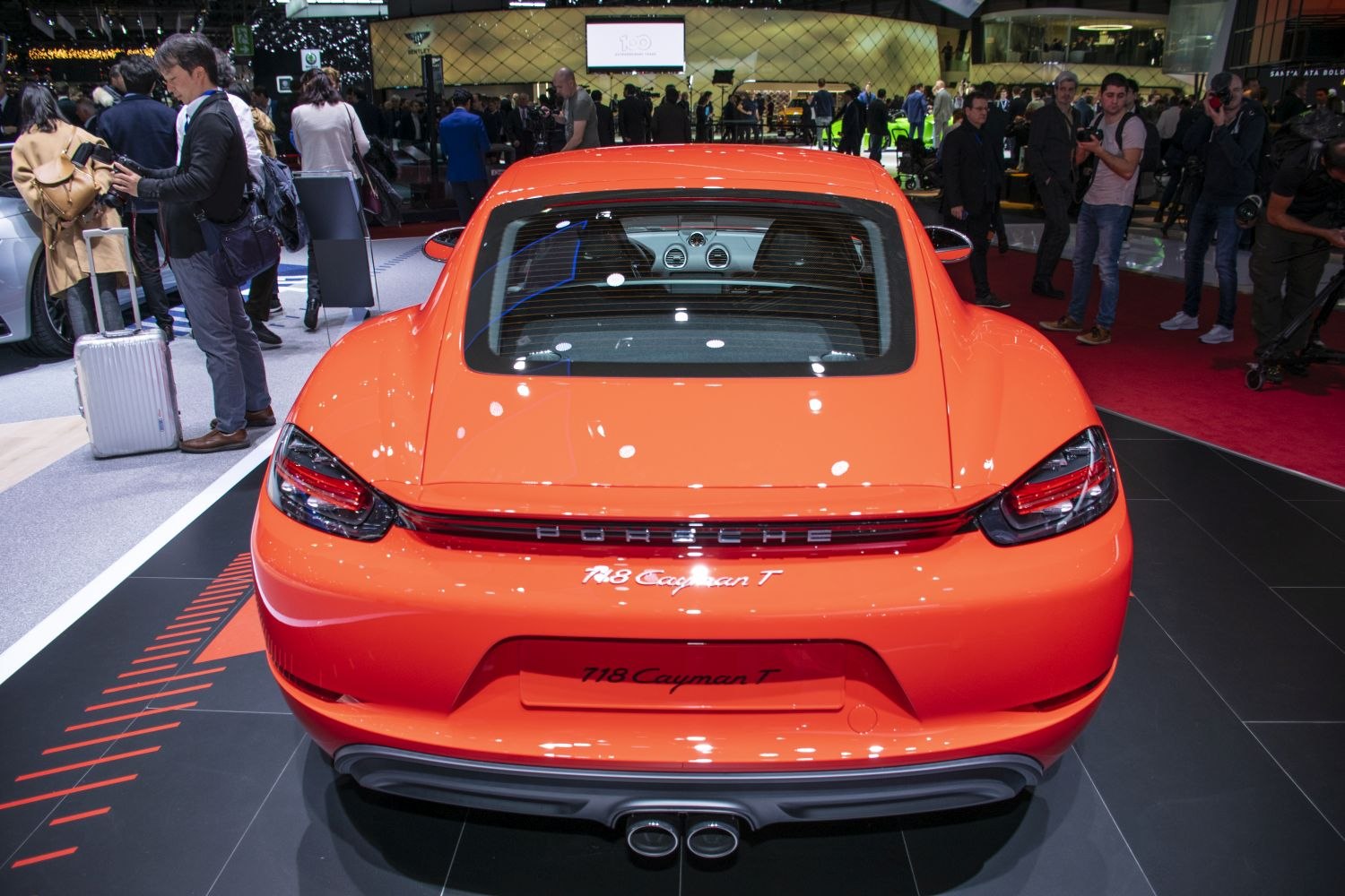 Bright rear showing dual exhaust and LED taillights in a sleek sports coupe design.