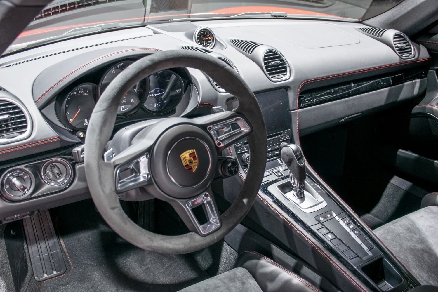 Luxury sports car interior with steering wheel and advanced dashboard