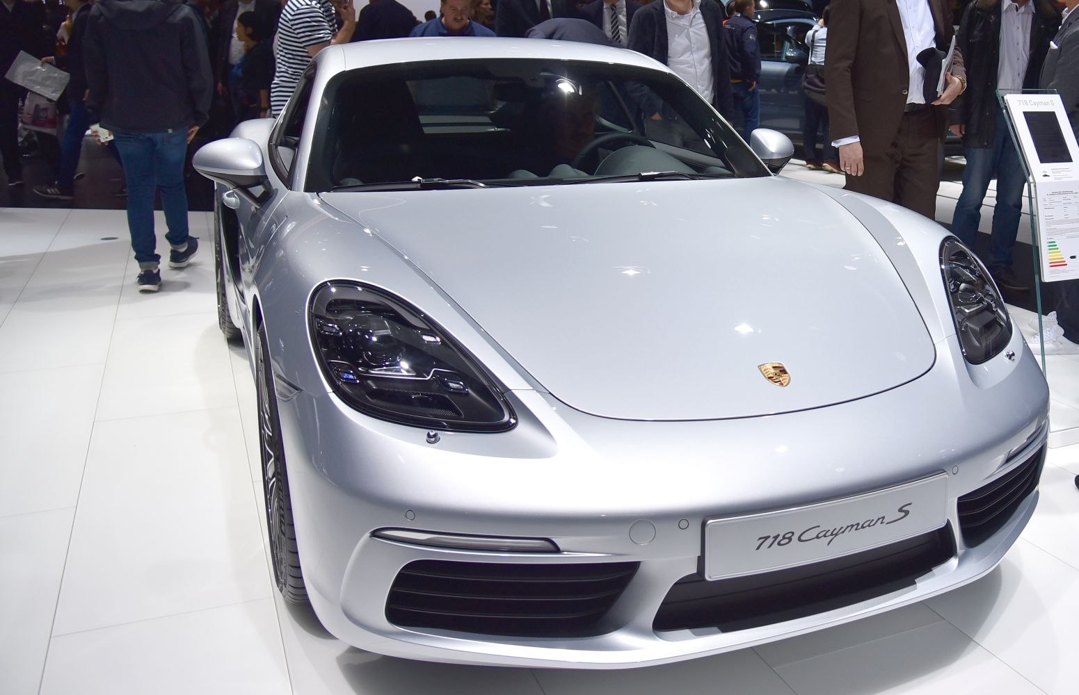Close-up of sports car front with prominent headlights and grille