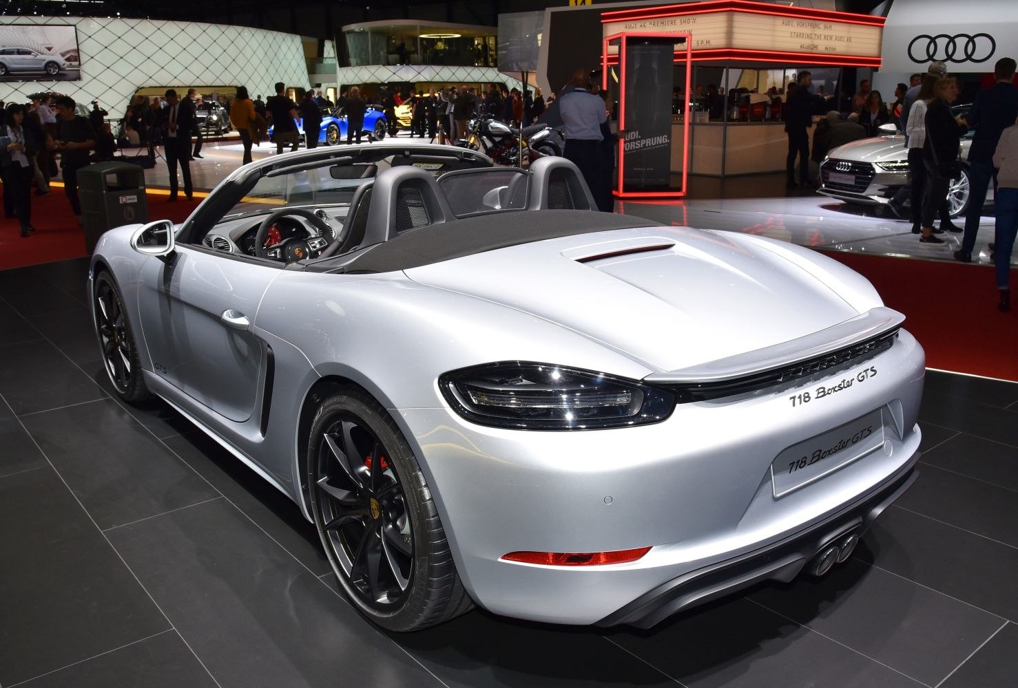 Convertible sports car rear view with aerodynamic design and black rims