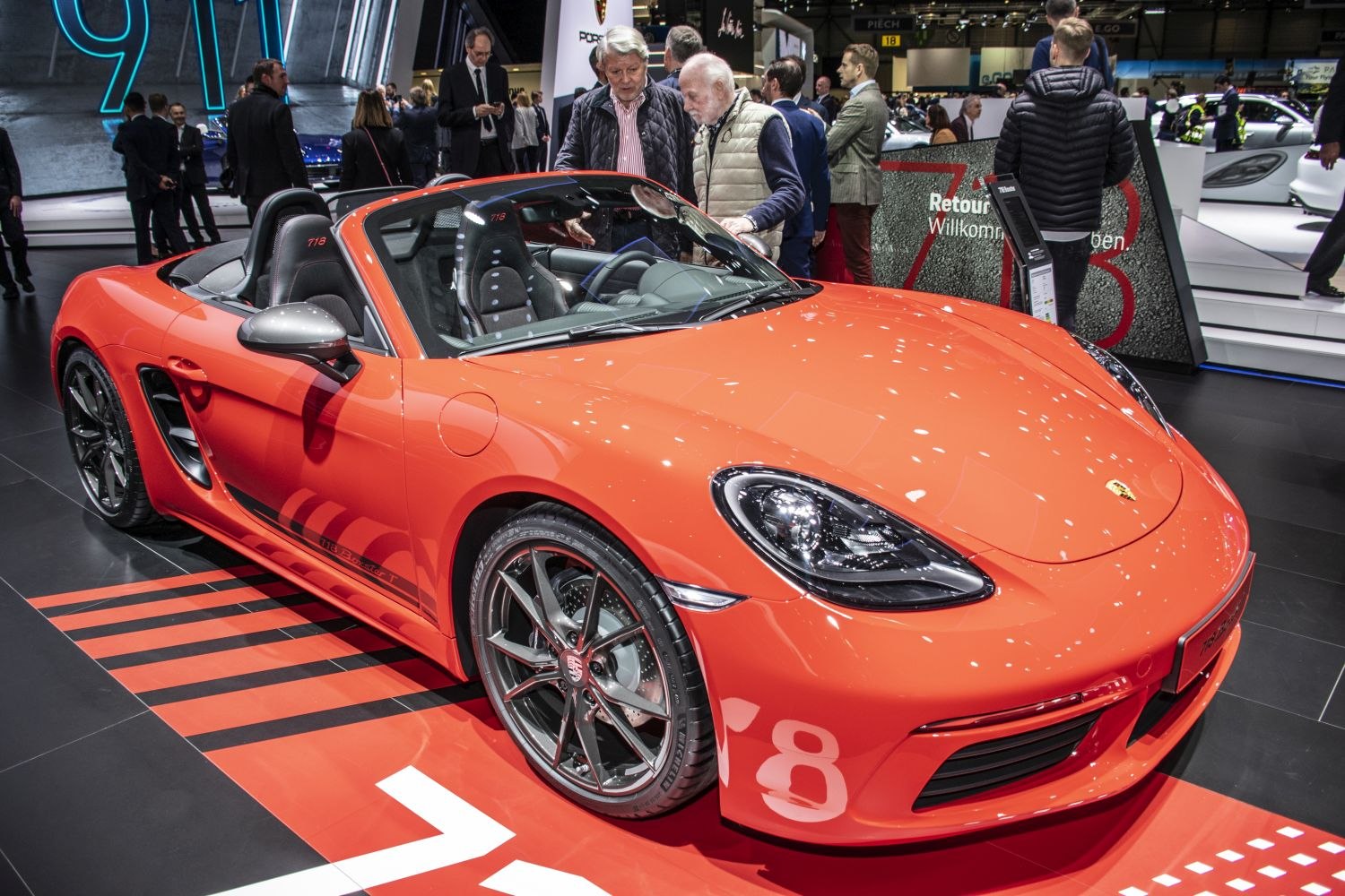 Red convertible roadster with aerodynamic front and detailed wheels
