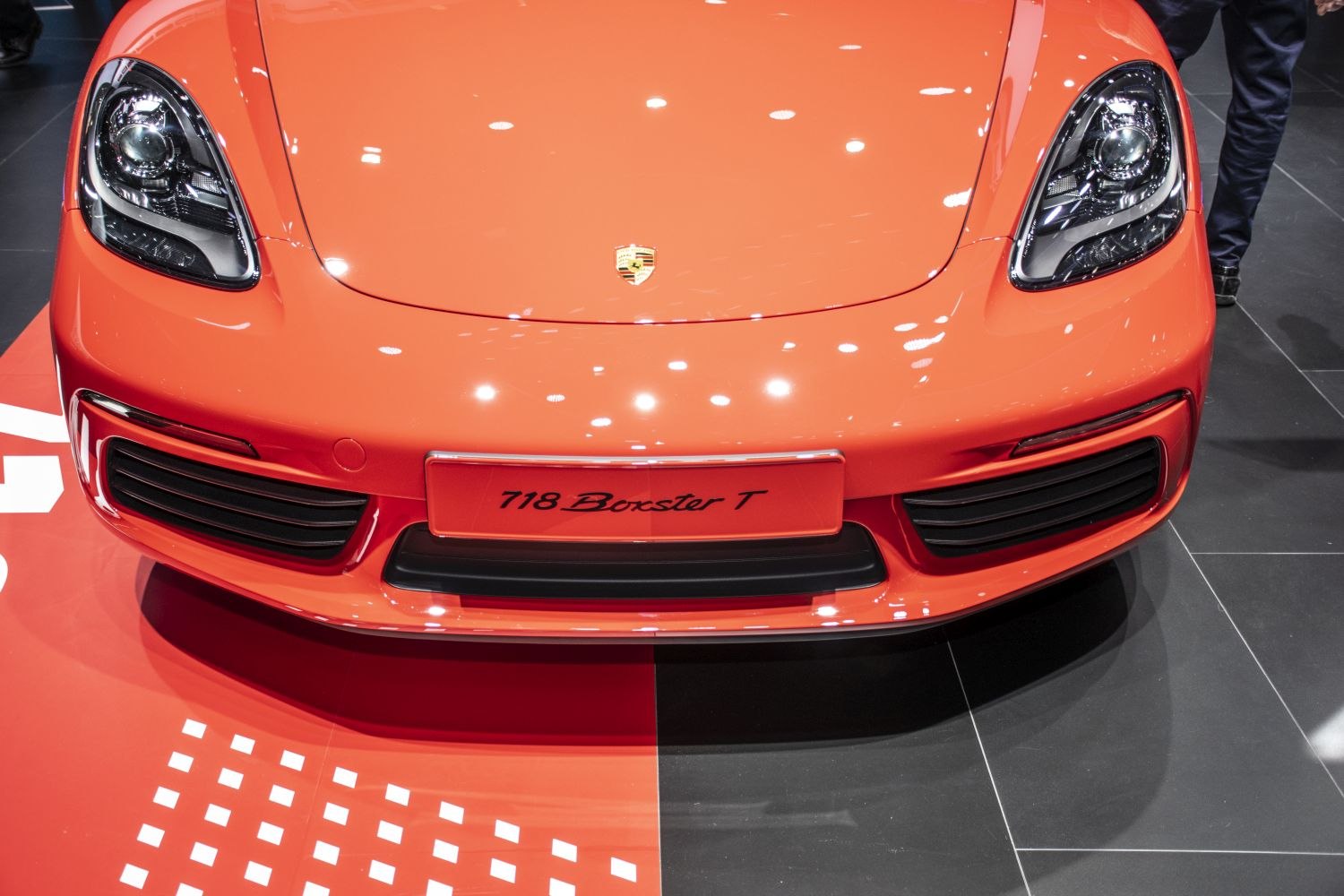 Front close-up showing headlights and grille of a sports convertible
