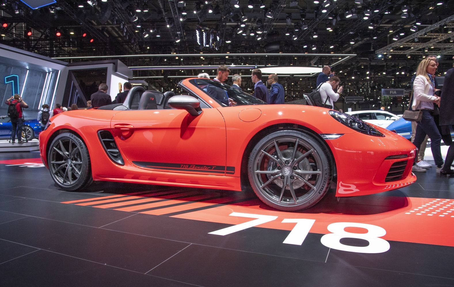 Red convertible with aerodynamic side vents and sleek alloy wheels.