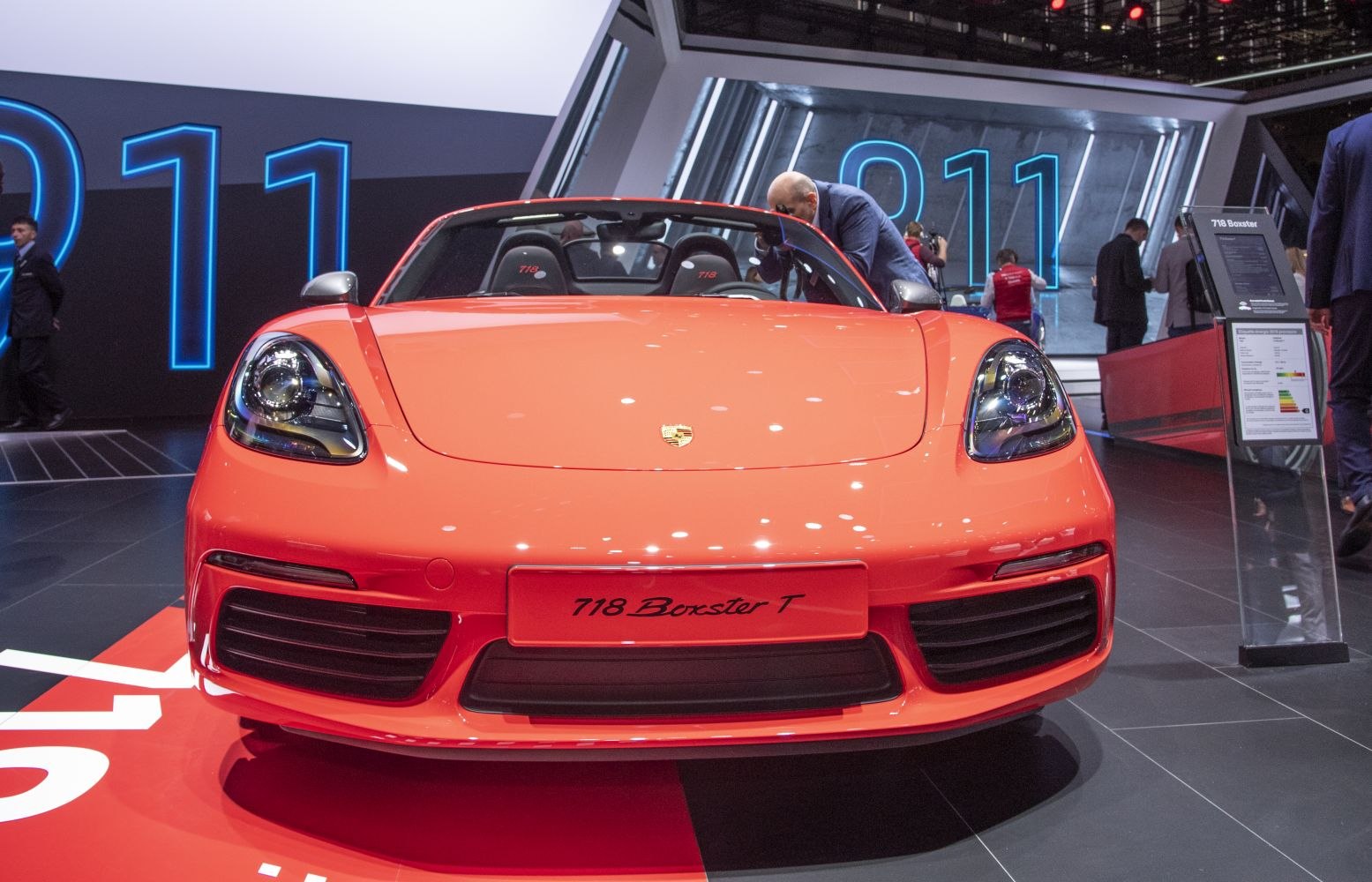 Front view of a sporty convertible featuring sleek headlights and an aggressive grille