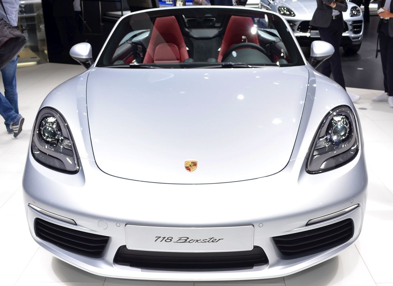 Front view of a convertible sports car with distinct headlights and hood