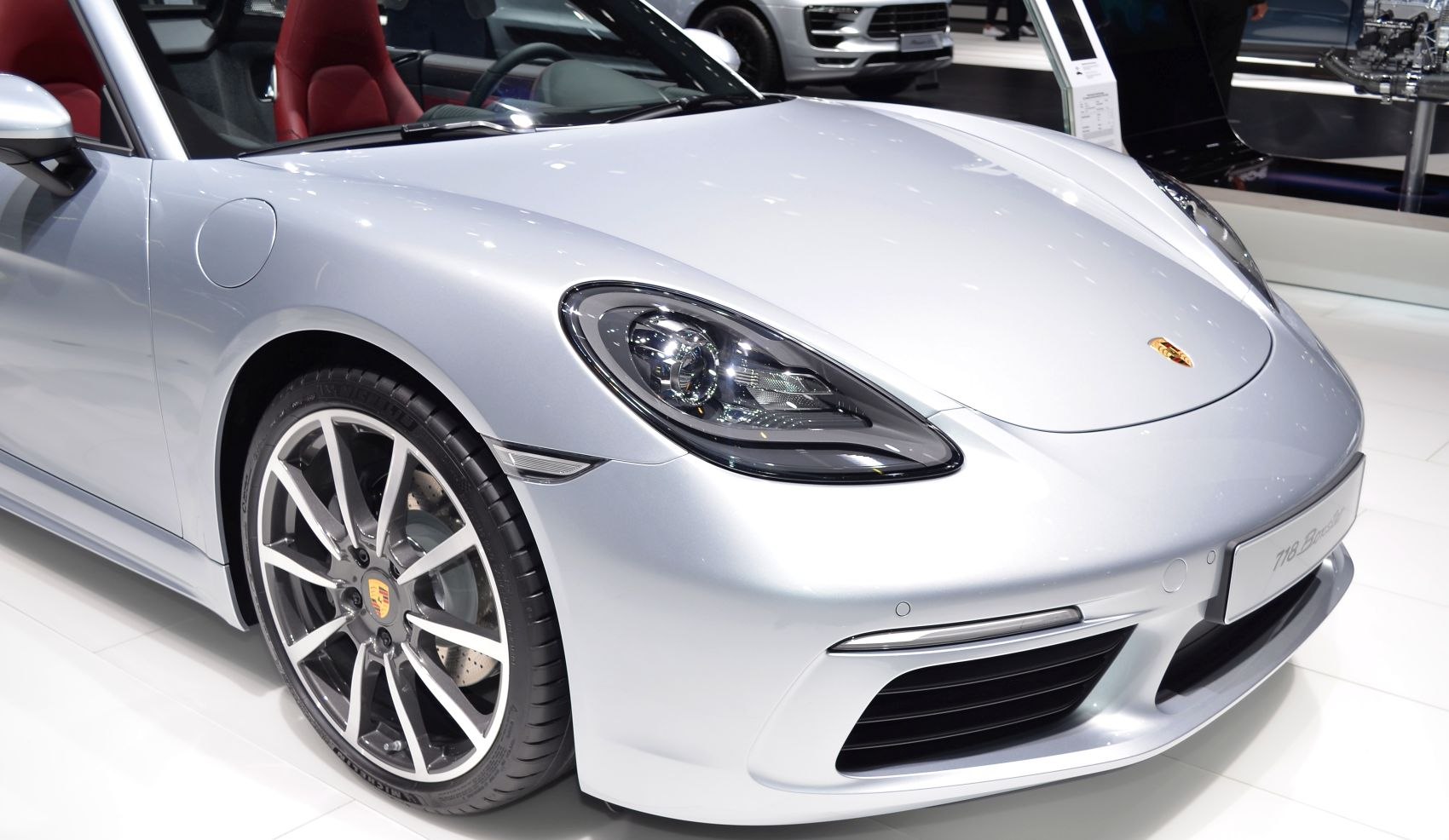 Front headlight and alloy wheel of a sports coupe