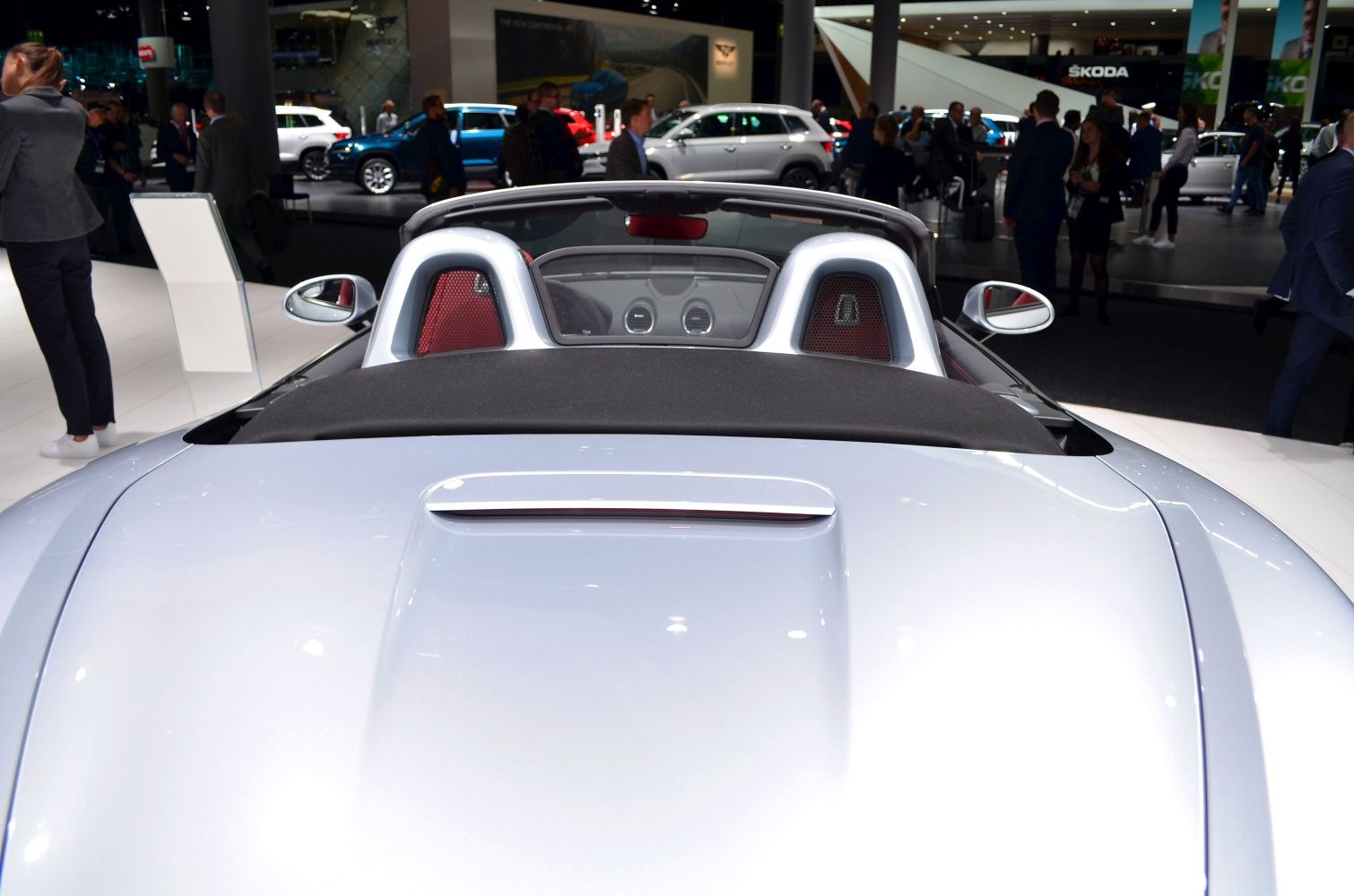 Convertible sports car rear with roll hoops and rear deck
