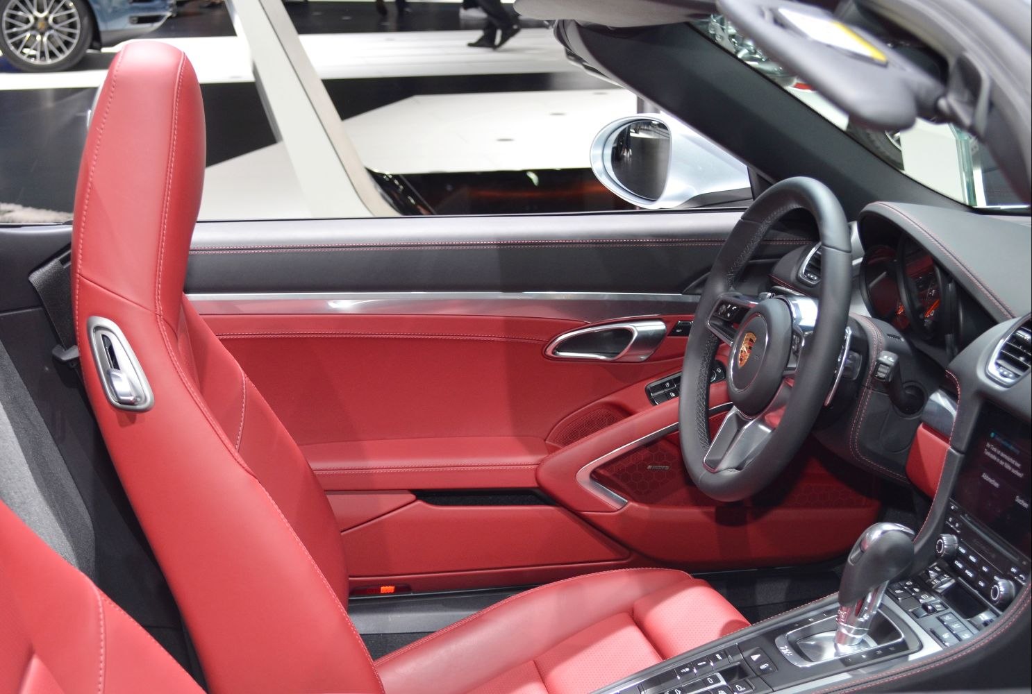 Red leather seats and modern sports car steering wheel