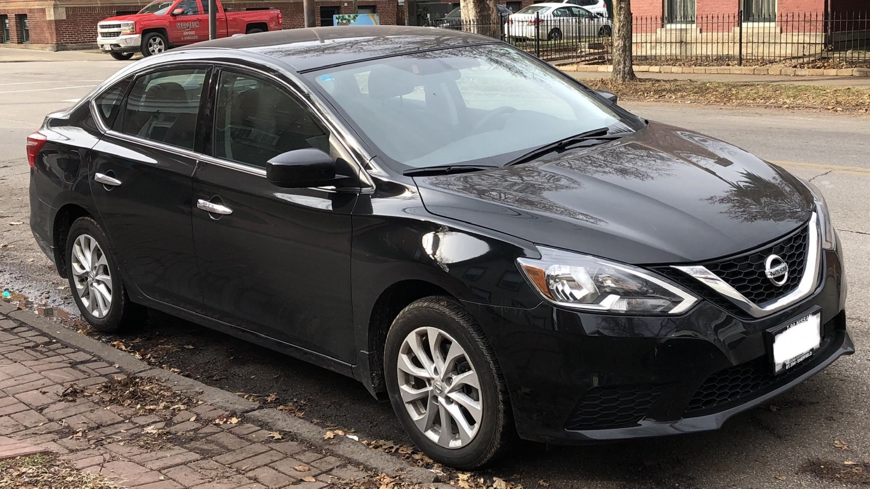 Side front exterior of a compact sedan with alloy wheels