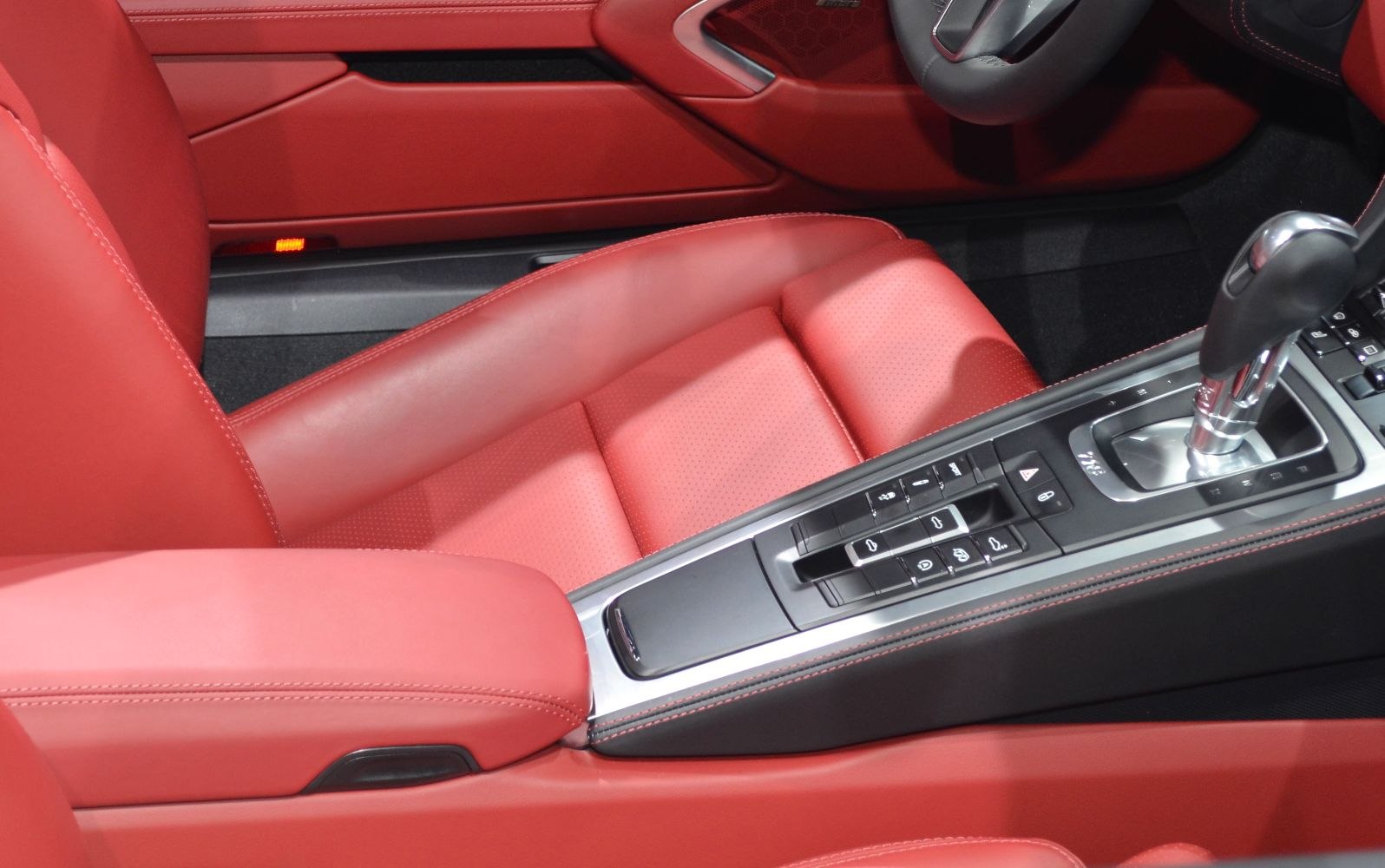 Red leather car seat and gear shift center console