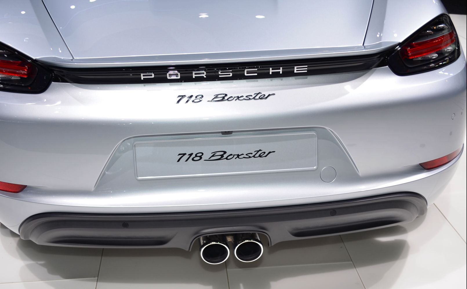 Rear view focused on dual exhaust, taillights, and badges