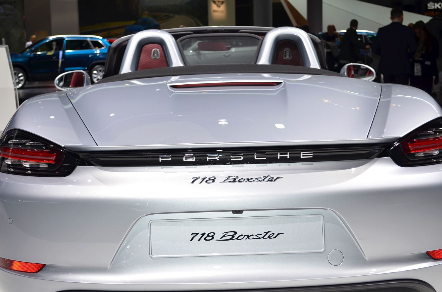 Rear convertible view with distinctive tail lights and roll hoops