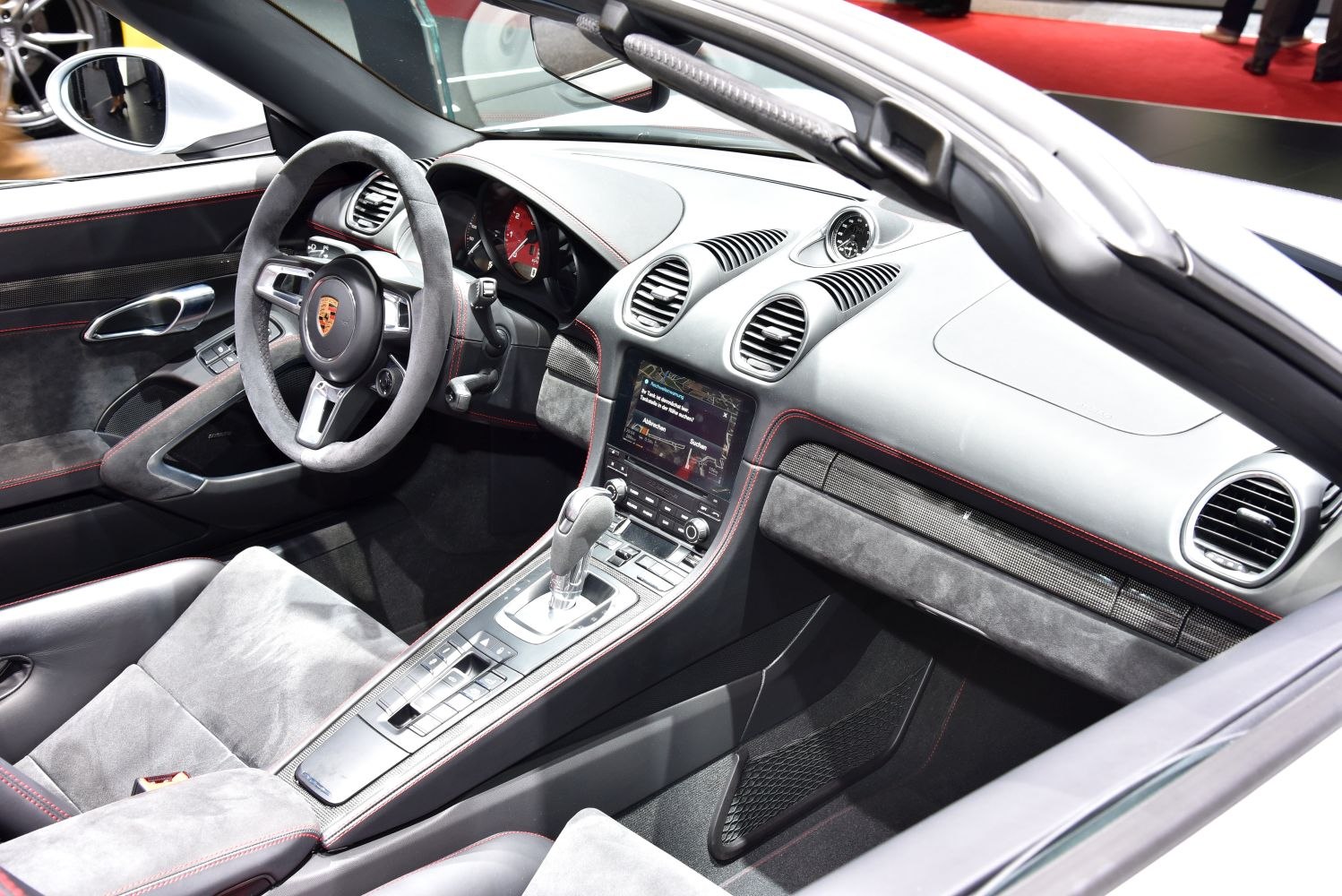 Luxury sports car interior with sports steering wheel and touchscreen display