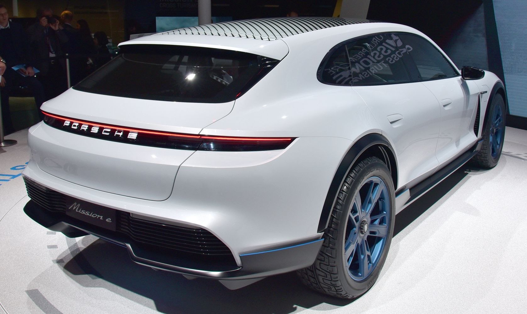 Rear view with continuous LED taillight and blue-accented wheels